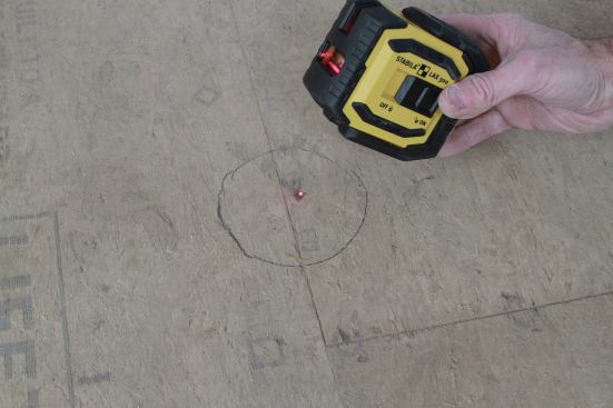 I use a small laser to project a dot on the ceiling to find the box location.