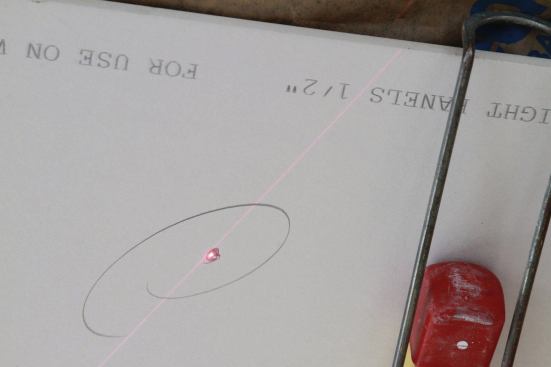 All you need is a mark on the ceiling that will allow you to plunge the router bit somewhere in the middle of the box.