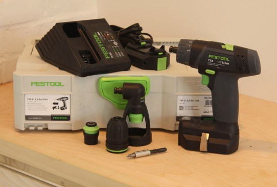The TXS Set comes with a charger, (2) 10.8 V batteries, 3/8" keyless chuck, centrotec chuck, BH60 Bit Holder and Systainer case. The TXS Plus comes with the FastFix right angle chuck as well.