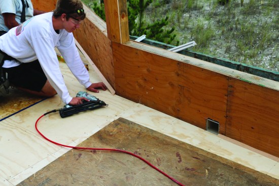 To ease the transition between the flat roof deck and vertical walls, cant strips ripped with a 45-degree angle were installed in all of the corners.