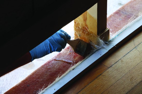 ... and disposable brushes were used to thoroughly saturate the fiberglass mat with resin.
