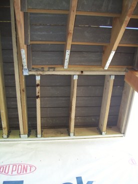 The double-ply beam supporting this stair landing is structurally unnecessary and could be replaced with a single 2x6, according to Table R507.5 in the 2018 IRC.