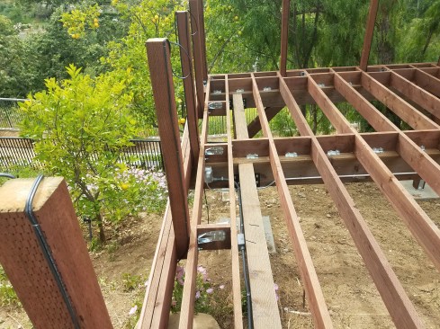 The deck posts were 45 inches high and through-bolted to the double rim joist with SST DTT2Z anchors, reinforced with plenty of blocking.