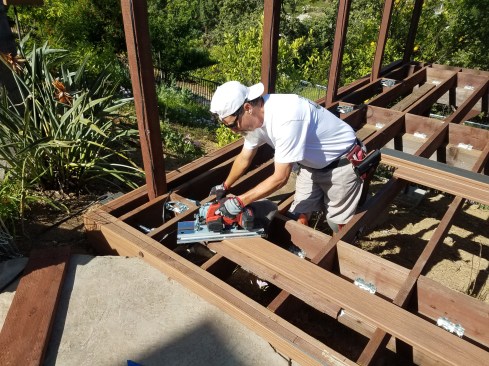 The author—a self-confessed “toolaholic”—used a Mafell cordless crosscut saw purchased in Germany to cut the miters for the picture-frame deck border.