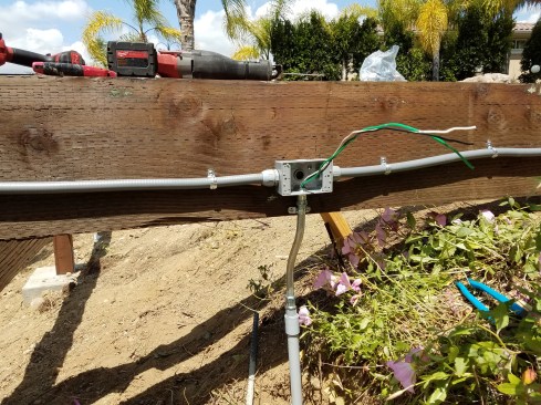 Power to the deck runs through buried watertight PVC conduit.