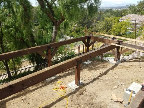 The frame was also reinforced in both directions with knee braces that were fastened to the beams and columns with 1⁄2-inch-diameter HDG all-thread rod.