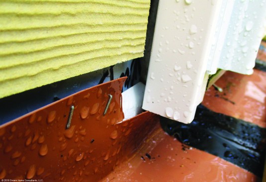 During a new-home inspection, the author discovered flashing that hadn’t been integrated with the water-resistive barrier underneath the home’s siding.