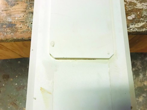 On most frames, the author cut a 3/8-inch-deep rabbet with a router around the inside back edge, then glued the 3/8-inch-thick PVC panel to the frame.