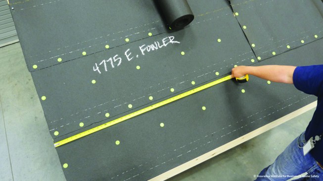 Fasten the felt to the roof with cap nails, 6 inches on-center at the edges and 12 inches on-center in the field.