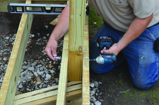 After the posts were plumbed and fastened to the deck frame with ThruLok screws.