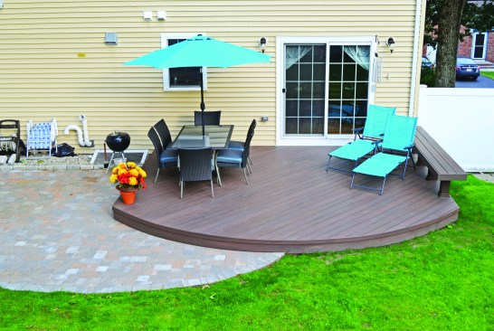 The clean and simple deck nicely matches the adjacent patio.