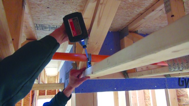 Adjustments to pipes should be made immediately, before the adhesive sets. The installer secures the pipe to the framing with a connector. Pipes need to be restrained against uplift from water pressure in the event that a sprinkler head activates.