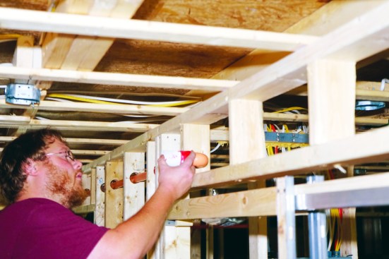 A cover protects the head during drywalling and painting. A paint touch-up pen can be used to repair any small scratches in the head’s paint caused by the wrench.