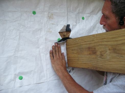 I remove the release paper from the wall leg of the flashing tape.