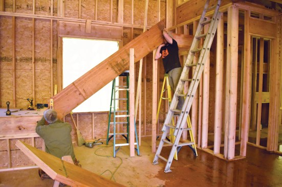 The upper and lower landings are structurally connected by a pair of 1 3/4-inch-by-16-inch-deep solid LVL stringers.