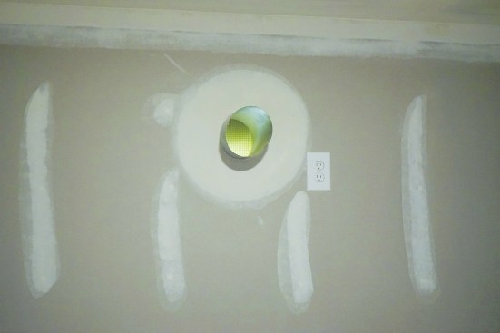 Screened vents provide cross-ventilation, required by code for an uninsulated crawlspace.