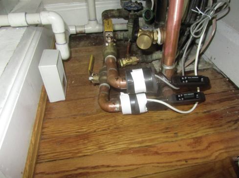 To evaluate the performance of a condominium AC unit, the author secured temperature sensors to the inlet and outlet pipes, and a flow-rate meter in the HVAC system feed line.