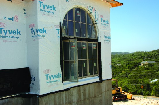 Driving by this site, the author stopped to look at the detailing on a large, recessed arch-top window. From a distance, it was evident it wasn’t flashed well.