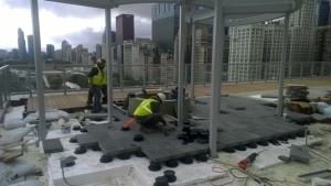 The pavers and wood decking were supported by Bison pedestals, which were placed on top of the foam.