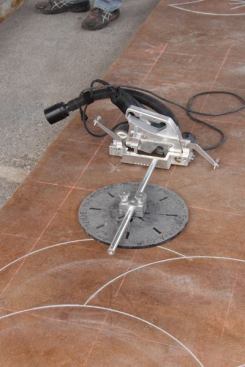 A
Mongoose concrete engraver attached to a circle jig.