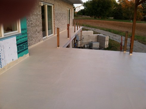 The top coating, available with or without non-skid granules, went on quickly with a roller.