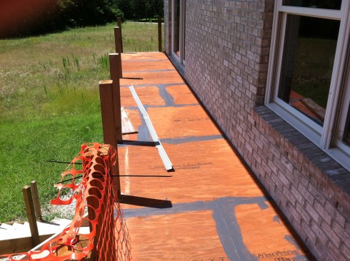 To prevent the plywood joints from telegraphing through the finish, the author filled the joints and other cracks with Bondo and sanded them smooth.