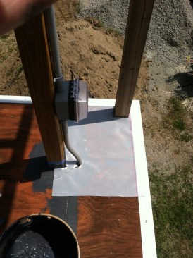 Patches cut from the polyester fabric supplied with the system were used to flash the guard posts and other penetrations through the roof deck.