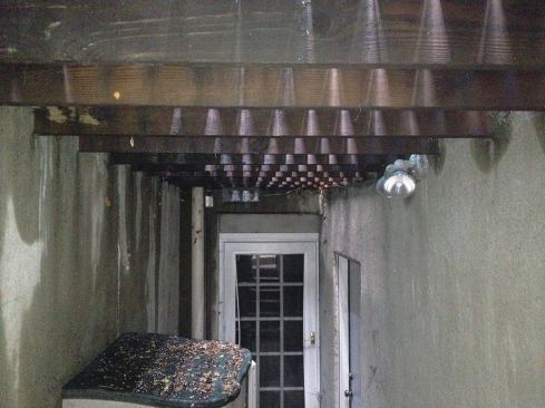 The basement entry to this Hoboken brownstone was gloomy, thanks to a small deck overhead. The plan was to introduce more light by adding a skylight to the deck above.