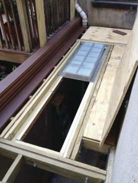 The skylight units were installed one at a time, with shims as necessary to level them and provide full bearing. Grey silicone sealant supplied by the manufacturer was used to fill the joint between the two units.