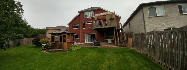 An afterthought to the home, the original deck was small and  rectangular, attached to a tall house lacking balance and vertical interest. The stairs lead straight down without a landing and were dangerous.