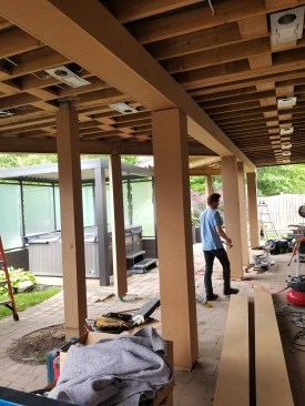 Below the Deck;  Everything below the deck is finished in PVC and aluminum. Aluminum soffits close in the joists and PVC covers the support posts, beams, troughs and fascia. The soffit matches the color of the home and the PVC ties in with the deck.