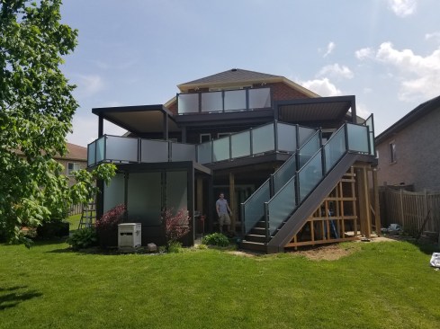 Privacy; Using frosted privacy glass we shielded less attractive views and continuing the frosted glass panels into the rails and down the stairs helps make it a private space wherever you are on the deck. The closed in below stairs with frosted glass created a privacy barrier from the neighbor's deck when you are in the hot tub.