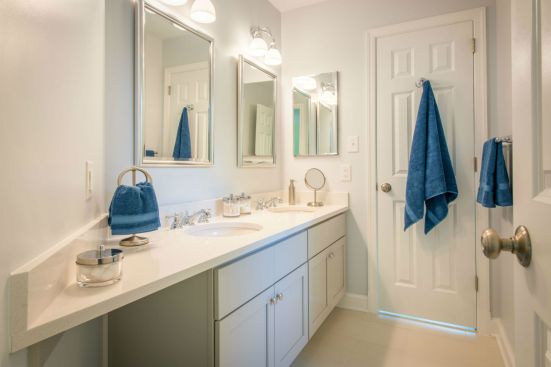 The two sisters who live in the Bethesda, Md., home have their own Jack and Jill bathroom to share. Situated between the two bedrooms of the second floor addition, the bathroom echoes the hues and materials found in the master bath, including ceramic tile and Caesarstone.