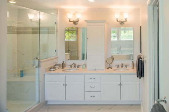 The neutral colors found in the kitchen are reflected again in the master bathroom, where his and her sinks and ample cabinet space create a comfortable retreat. 