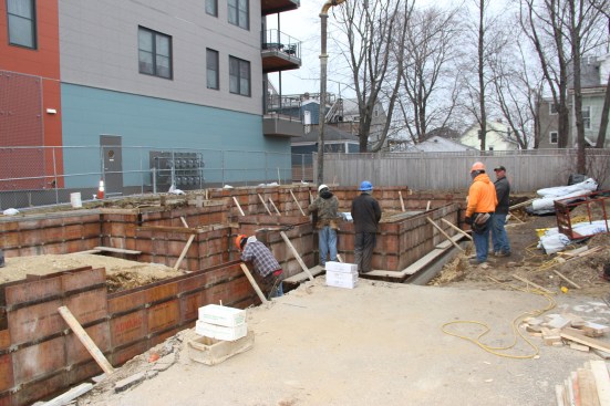 The crew starts the wall pour.