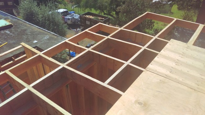 At corners, tapered blocking forms a grid the framing crew called “the diamond”.