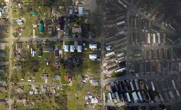 Five Habitat For Humanity houses, center, stood firm during Hurricane Michael even as an adjacent trailer park saw heavy damage.