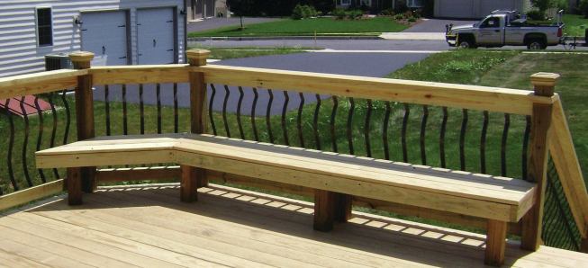Decorative metal balusters dress up this sturdy but basic railing design, which is also built with treated southern yellow pine. 

					