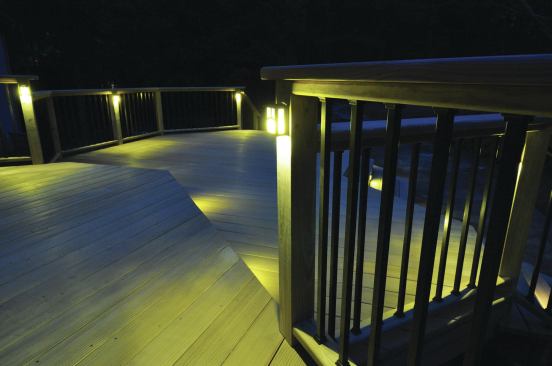 Even though these posts and rails are wood, they're designed to accommodate the electrical wiring needed for deck lighting.