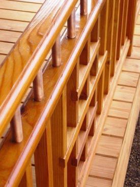 This rail design features a double top rail made of cedar and short upper balusters made from 3/4-inch diameter copper plumbing pipe.