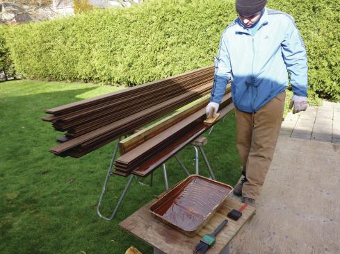 These boards are being treated with an oil-based coating. Water-based products can’t be used because the treated wood doesn’t absorb water.