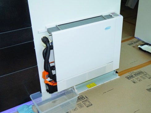 A wall-mounted hydro-air emitter
