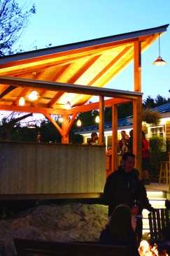 Warm outdoor lights enhance an evening cookout.