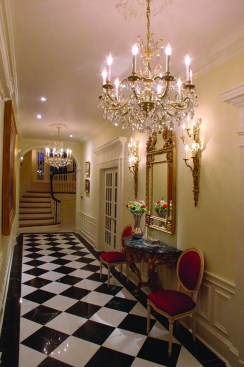The chandeliers in this kitchen and hallway have halogen bulbs, as do the hallway sconces. LED replacements for the 15-watt lamps are available, but Mazon said, “No LED is going to replicate incandescent or halogen precisely.”