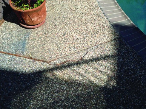 The surrounding concrete and wood decks were also failing.