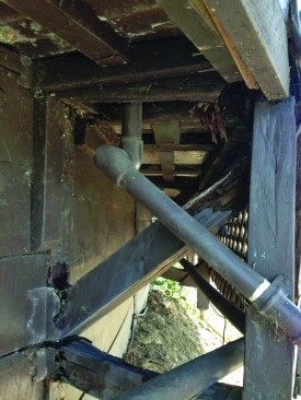 Wood laggings in the retaining wall that flanked one side of the pool were rotted and giving way.