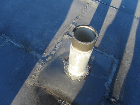 This site-made metal flashing is less reliable than a factory-built one. 