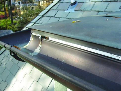 Drip edge that doesn’t hang into the gutter can direct water behind the gutter and soak the fascia and soffit, as shown above.