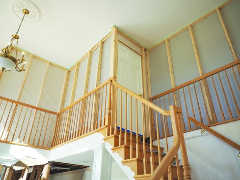 A wood screen door or demoed interior door makes a good dust containment door.