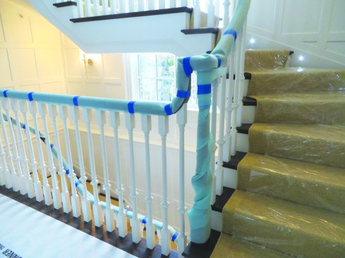 For stair railings, the author recommends wrapping the railing in sill sealer and tape.